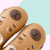 Caramel EVA slippers with Capybara design - lined with white plush inside. 