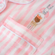 Fairtale Cotton Pyjamas Set (3PCs) - a pink pastel pyjamas top, with a classic pyjamas collar detail and the image is zoomed in on the pocket detail. It has a hand drawn bunny that looks fairy tale peeking out of the pocket.  Soft fabric made of cotton. 
