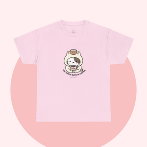 Pastel pink t-shirt featuring a cute cartoon cat holding a coffee cup, with the slogan “No talkie before coffee.” Playful, minimalist, and kawaii design from The Linea Home Kitty Squad collection.