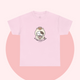 Pastel pink t-shirt featuring a cute cartoon cat holding a coffee cup, with the slogan “No talkie before coffee.” Playful, minimalist, and kawaii design from The Linea Home Kitty Squad collection.