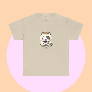 Beige t-shirt in a boba tea shade, featuring a kawaii cartoon cat holding a coffee cup and the slogan “No talkie before coffee.” Minimalist and playful, from The Linea Home Kitty Squad collection.