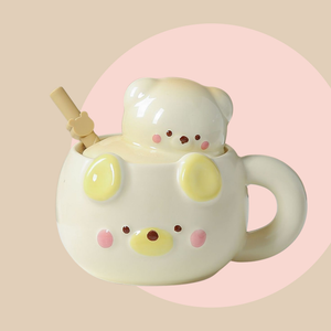 Ceramic mug shaped like a cute bear in a butter cream colour. lid has a matching colour and has a 3D bear head as the handle.