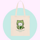 Tote bag with a green cat illustration and text on a pastel background