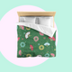 Bed with colourful fireworks in traditional Japanese pattern bedding with on a matcha green background. Several designs of Japanese paper fans are dotted around