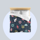 Bed with colourful fireworks in traditional Japanese pattern bedding with on a dark bluish grey night sky background. Several designs of Japanese paper fans are dotted around