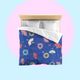 Bed with colourful fireworks in traditional Japanese pattern bedding with on a nippon blue background. Several designs of Japanese paper fans are dotted around