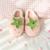 Pink plushy slippers that looks like strawberries finished in green plushy leafy stalk and seeds detail. Thick shoe sole with plush lining the interior!