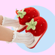 Red plushy slippers that looks like strawberries finished in green plushy leafy stalk and seeds detail. Thick shoe sole with plush lining the interior!